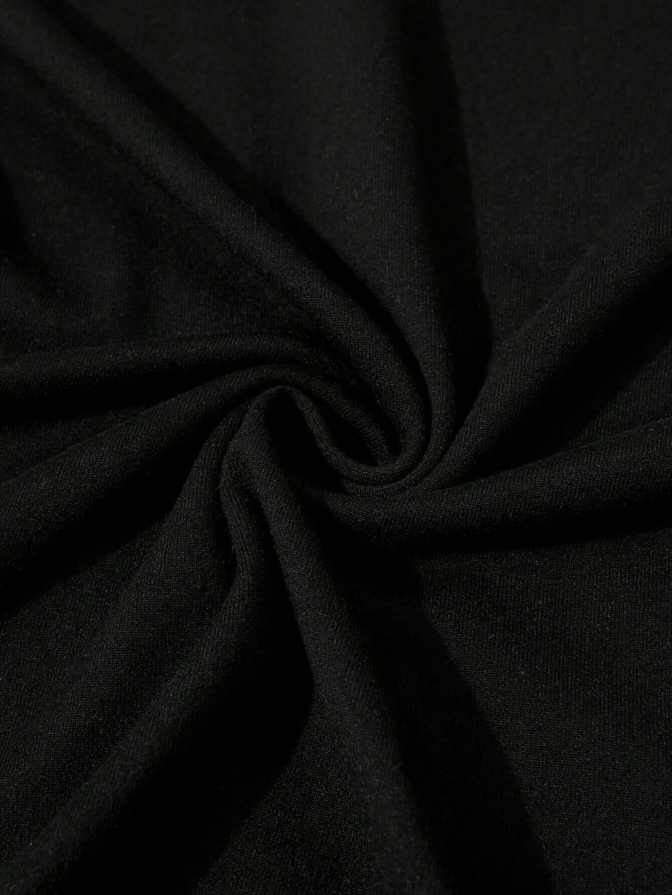 Close-up of soft black polyester fabric showcasing smooth texture, ideal for women's graphic tees.