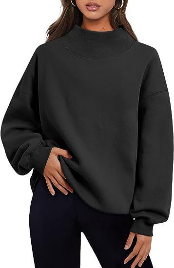 Solid color women's pullover hoodie in black, featuring a loose fit and round neck design, perfect for casual wear.