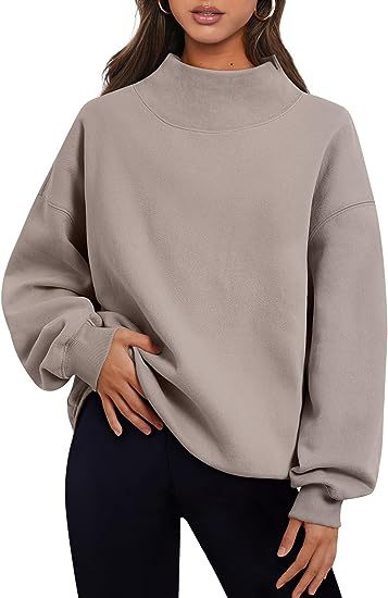 Solid color women's pullover hoodie in a stylish, loose fit, perfect for casual looks and comfortable wear.