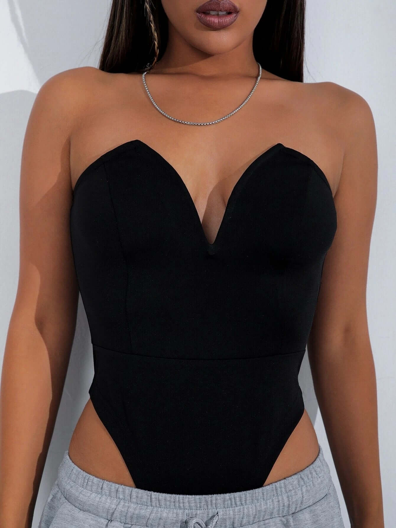 Sexy V-Chest One-Piece Tops Women Tight Bottoming Shirt Slim Slimming Onesies in black, showcasing a strapless design.