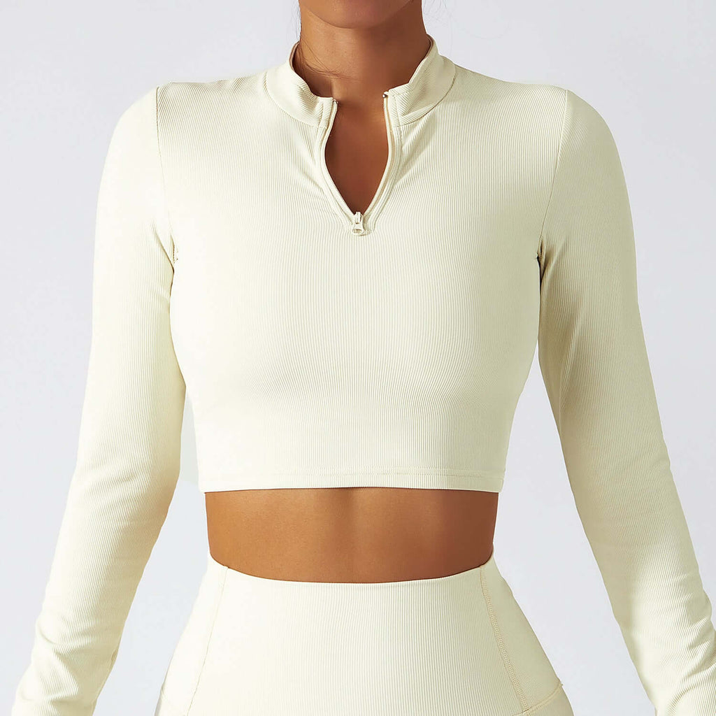 Stand collar zipper long sleeve quick dry yoga tops for women in a stylish beige shade.