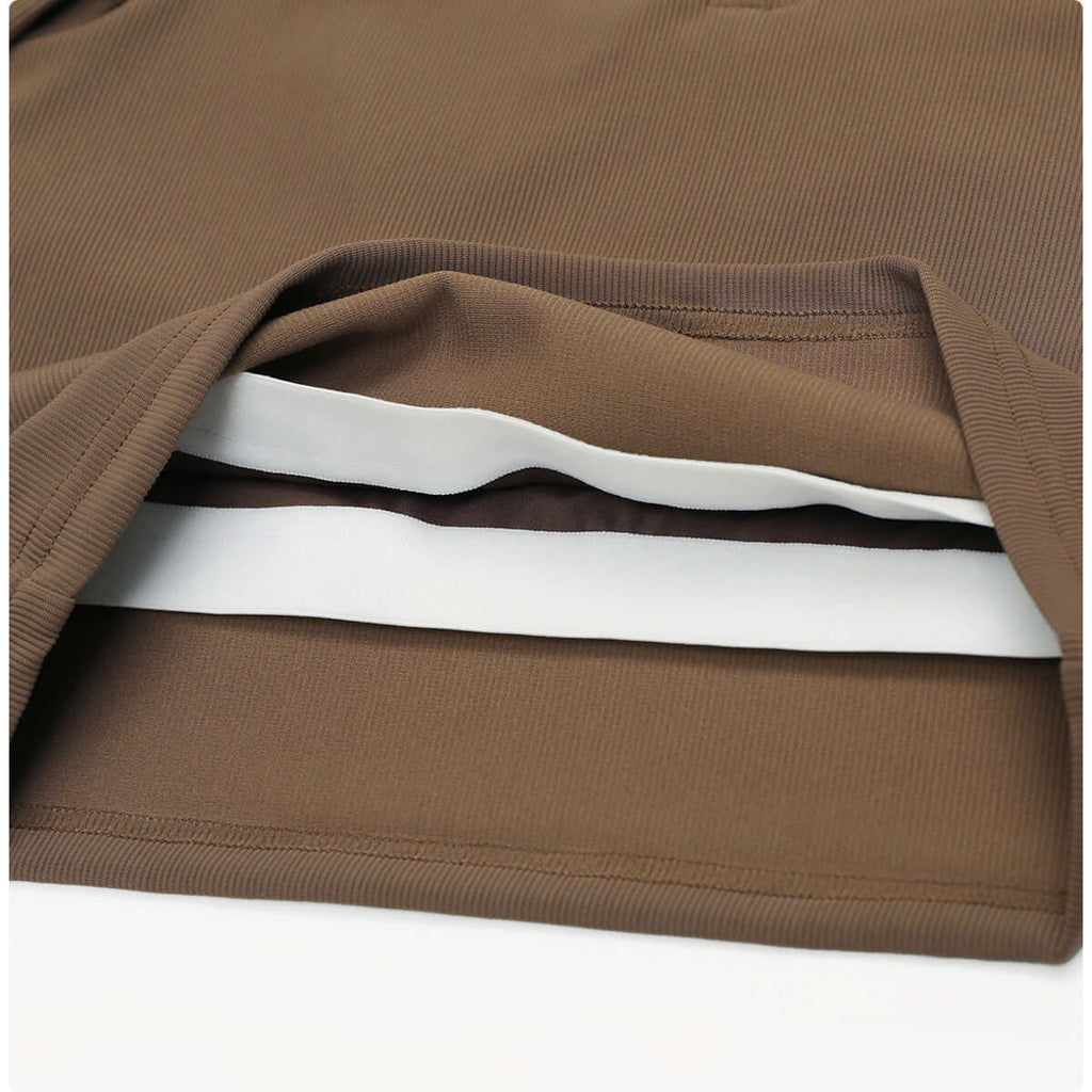 Detail of the fabric layers in brown quick dry yoga tops for women, showcasing premium quality and moisture-wicking properties.