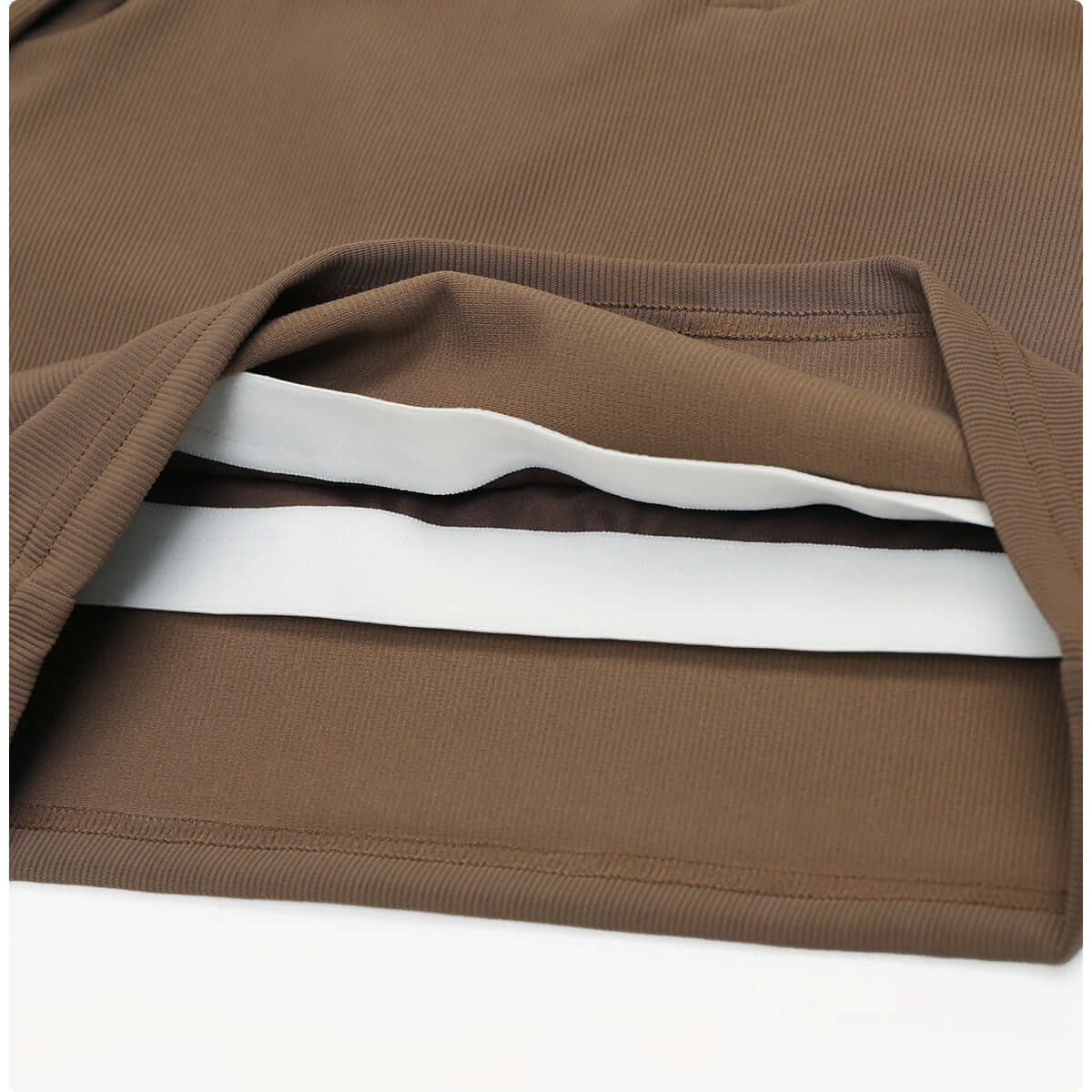 Detail of the fabric layers in brown quick dry yoga tops for women, showcasing premium quality and moisture-wicking properties.